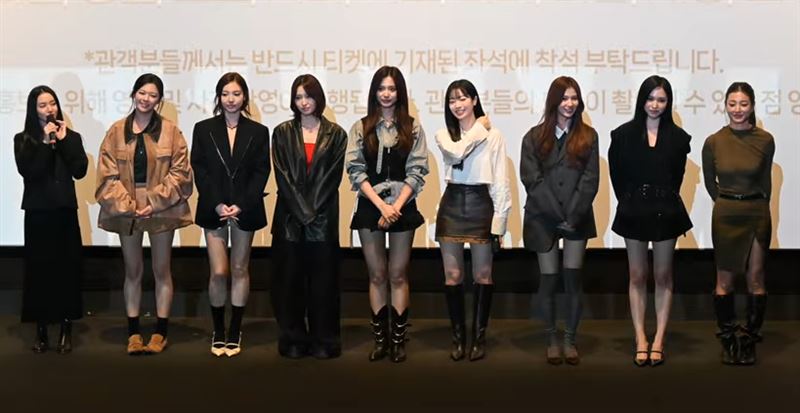 定延穿着褐色皮衣和深色短裤